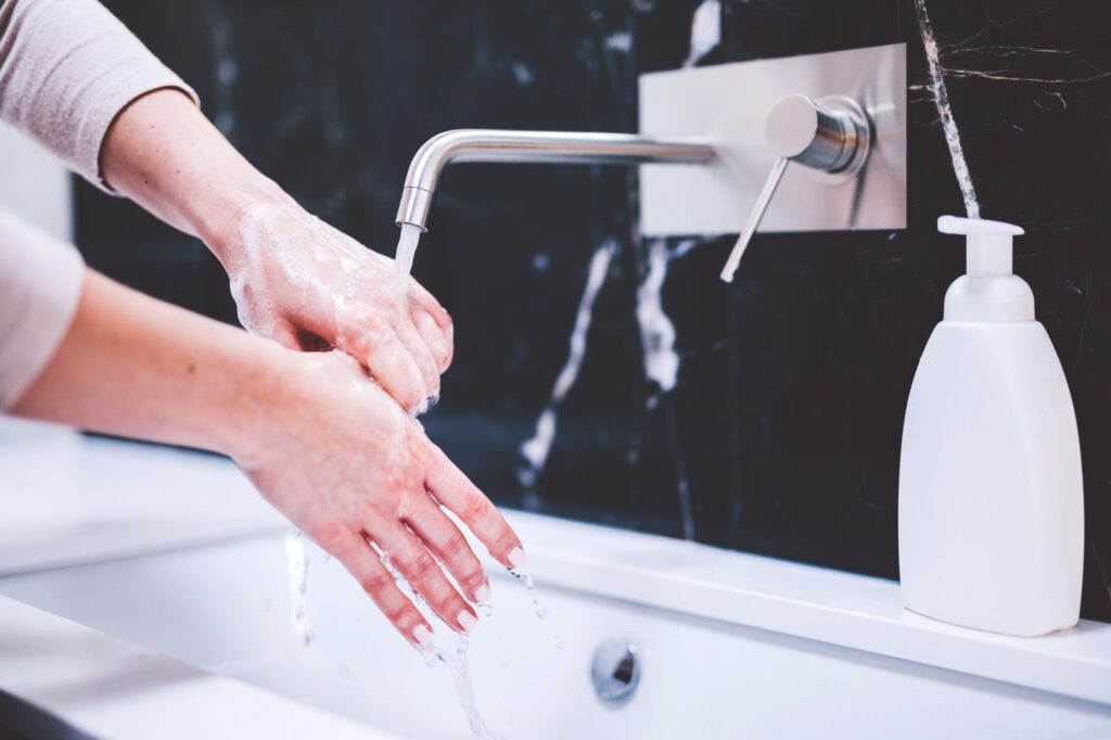 Washing hands with foam soap. Hygiene, preventing coronavirus